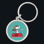 Peanuts | Snoopy the Flying Ace Keychain<br><div class="desc">This cute Peanuts design features Snoopy as the World War I flying ace reading to take on the Red Baron of Germany.</div>