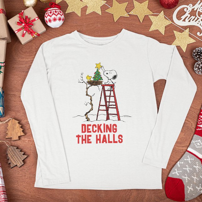 Peanuts | Snoopy & Woodstock Christmas Tree Tri-Blend Shirt (Shirt on Christmas table)