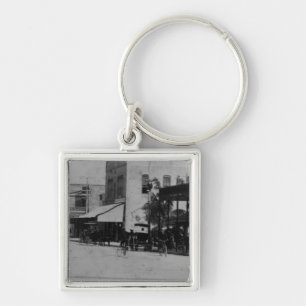 Pedestrians, cyclists, and horse-carriages keychain