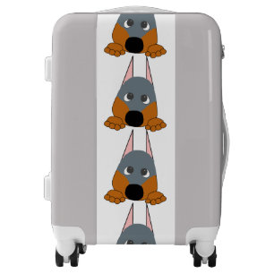 peeking dobie blue and rust luggage