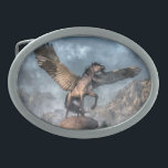 Pegasus Oval Belt Buckle<br><div class="desc">A great winged horse stands atop a rocky mound. It sniffs at the cold air of a forested valley line with jagged snow-capped mountains. Its dark mane and tail whip in the wind as the Pegasus spreads it wings, ready to take flight. The Pegasus is winged horse from Greek mythology....</div>