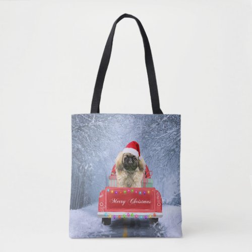 Pekingese Dog in Snow sitting in Christmas Truck  Tote Bag