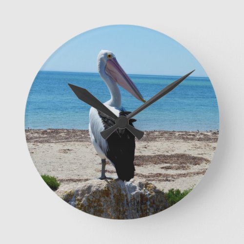 Pelican On Beach Rock Round Clock