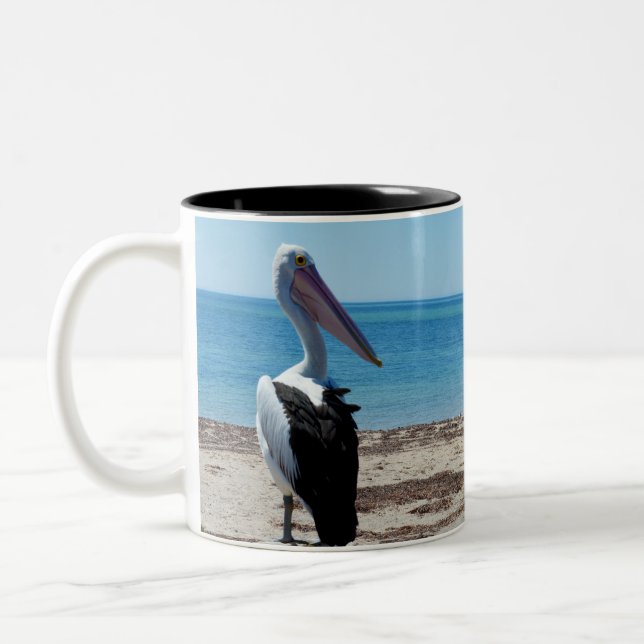 Pelican Perched On A Beach Rock, Two-Tone Coffee Mug (Left)