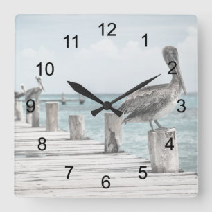 Pelicans On The Pier Square Wall Clock