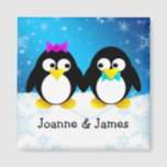 Penguin Couple Magnet<br><div class="desc">Two cute black and white penguins holding hands on a winter snowy day. A template below the penguins to add your names.</div>