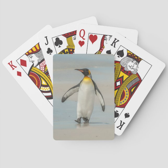 Penguin walking on the beach poker cards (Back)
