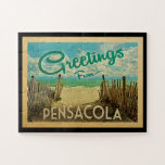 Pensacola Beach Vintage Travel Jigsaw Puzzle<br><div class="desc">This Greetings From Pensacola vintage postcard design features a sandy beach with a beautiful turquoise ocean water and above the sea,  a blue sky with billowy white clouds. In vintage travels style.</div>