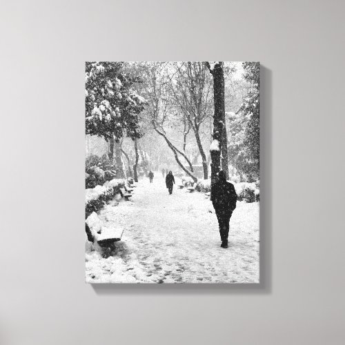 People at park in snowy winter day canvas print