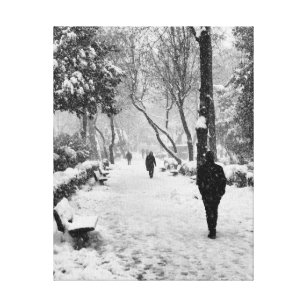 People at park in snowy winter day canvas print