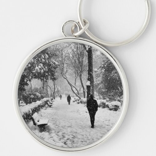 People at park in snowy winter day keychain