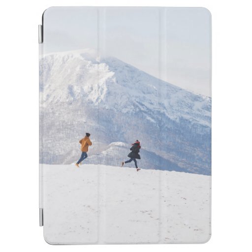 People having fun and running in mountains on the  iPad air cover