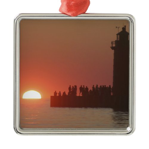People lighthouse sunset silhouette at South Metal Ornament