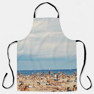 People on brown sand beach apron