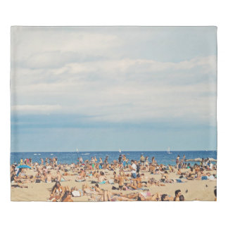 People on brown sand beach duvet cover