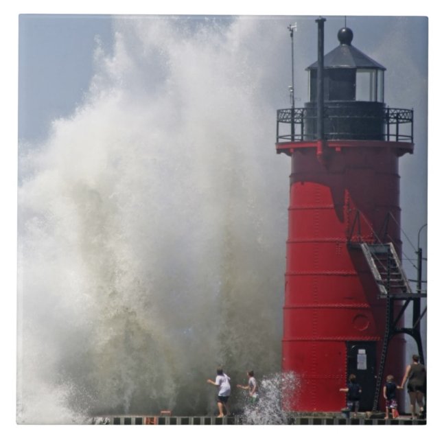 People on jetty watch large breaking waves in ceramic tile (Front)