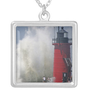 People on jetty watch large breaking waves in silver plated necklace