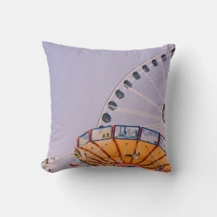 People riding on yoyo ride at daytime throw pillow