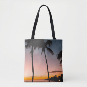People sitting on beach near sea tote bag