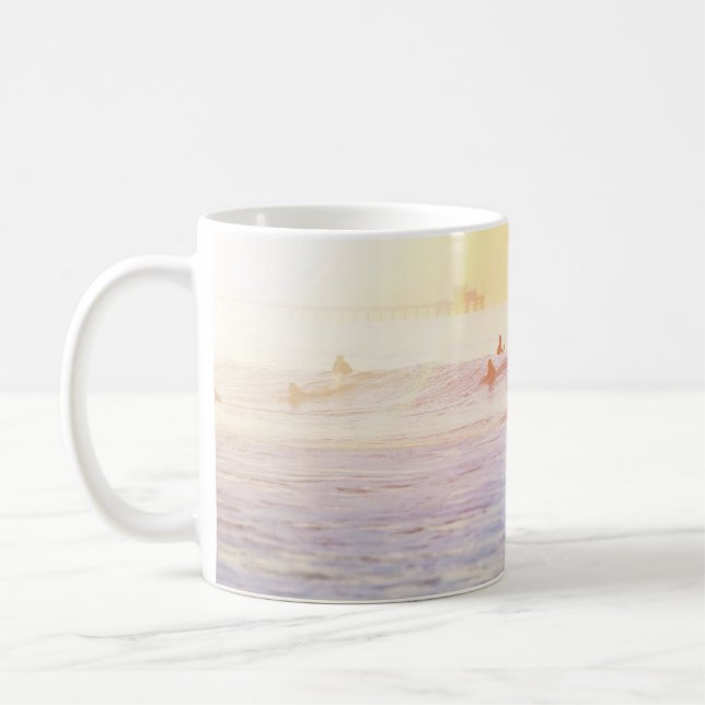 People surfing on beach coffee mug (Left)