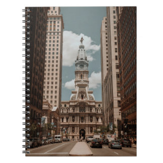 PEOPLE WALKING ON STREET NEAR HIGH RISE BUILDINGS  NOTEBOOK