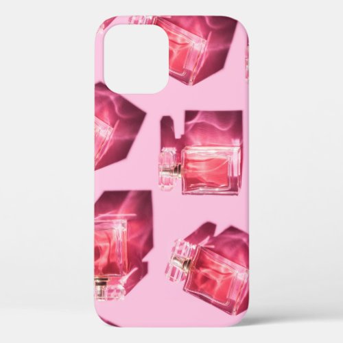 Perfume bottles pink background flatlay iPhone 12 case