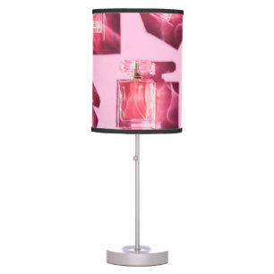 Perfume bottles, pink background, flatlay table lamp
