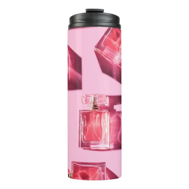 Perfume bottles, pink background, flatlay thermal tumbler (Front)