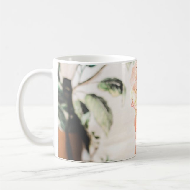 Person holding ice cream cone with three flavors o coffee mug (Left)