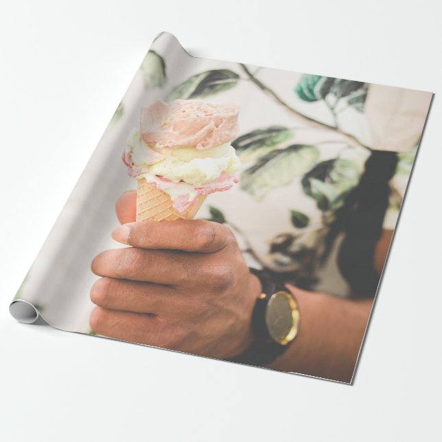 Person holding ice cream cone with three flavors o wrapping paper (Unrolled)