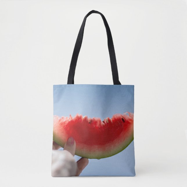 Person holding sliced watermelon tote bag (Front)