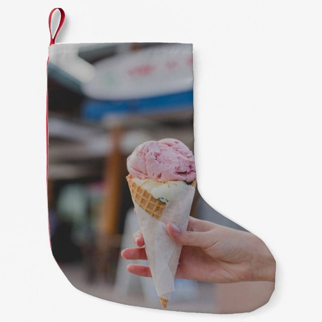 Person holding strawberry ice cream small christmas stocking (Front)