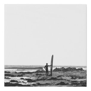 PERSON HOLDING SURFBOARD NEAR BODY OF WATER FAUX CANVAS PRINT