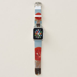 Person holding watermelon-themed inflatable ring apple watch band