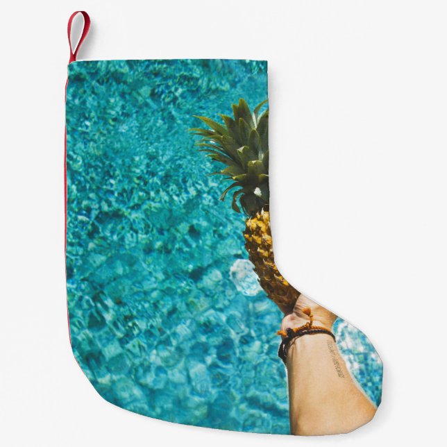 Person holding yellow pineapple small christmas stocking (Front)
