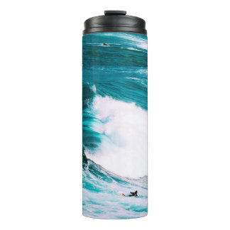 Person on surfboard with ocean waves thermal tumbler