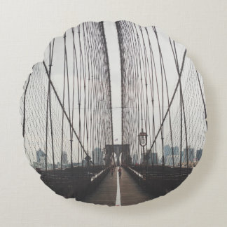 PERSON RUNNING ON BRIDGE ROUND PILLOW