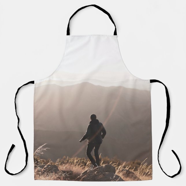 Person standing on rock apron (Front)