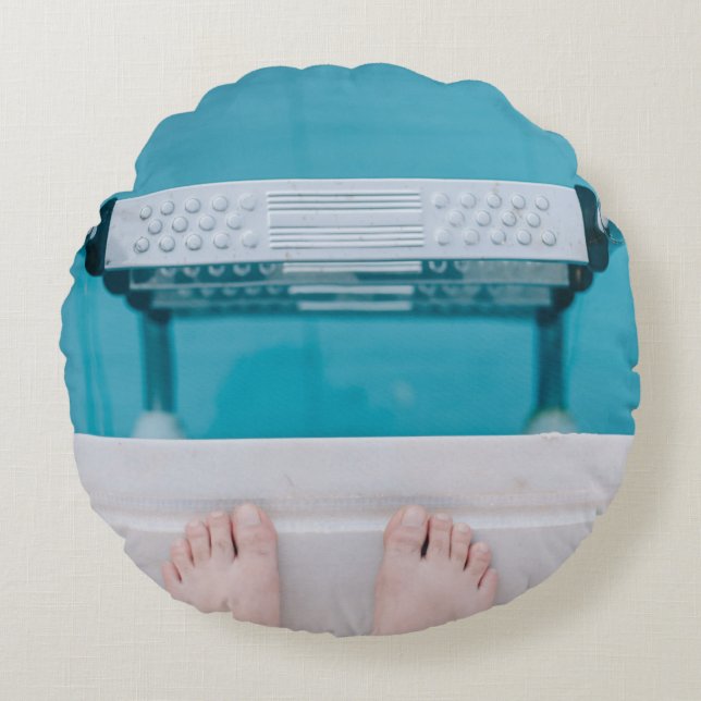 Person standing on swimming pool ladder round pillow (Front)