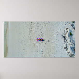 Person sunbathing at the beach poster