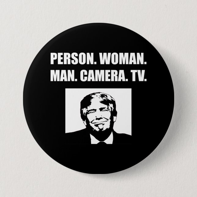 Person. Woman. Man. Camera. TV. Anti-Trump Button (Front)