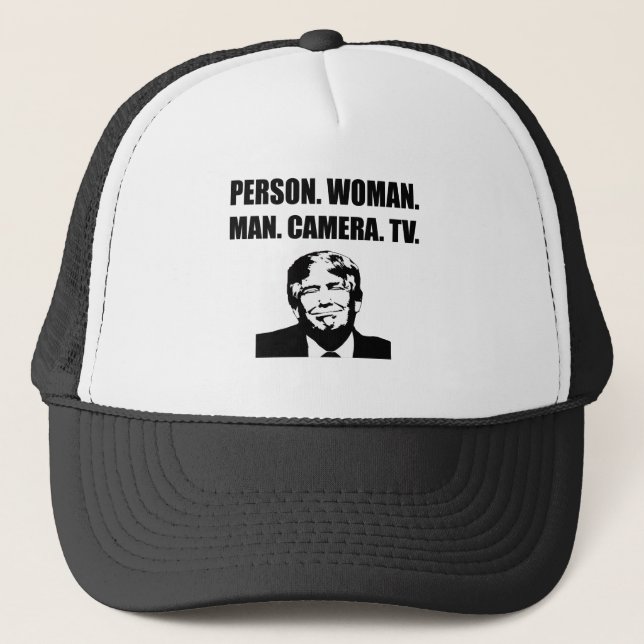 Person. Woman. Man. Camera. TV. Anti-Trump Trucker Hat (Front)