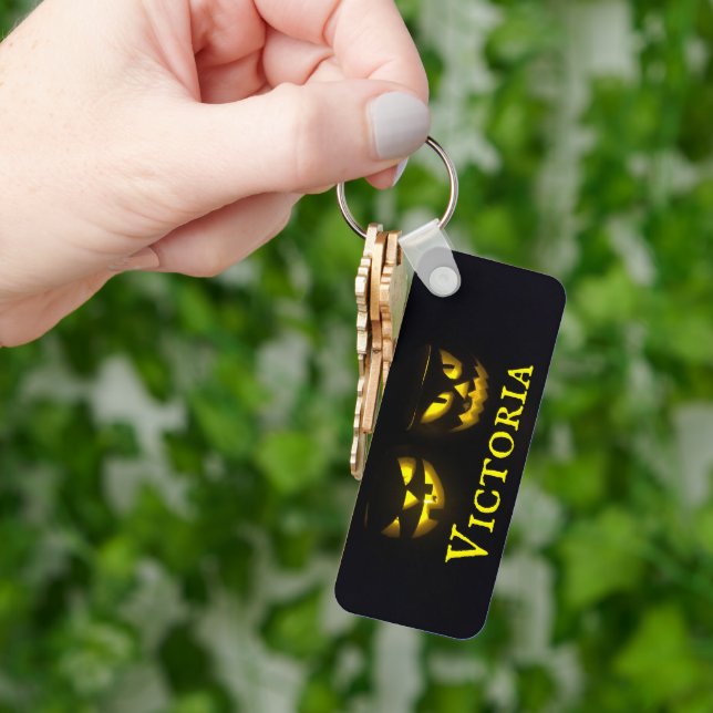 Personalised yellow on black creepy pumpkin faces keychain (Hand)