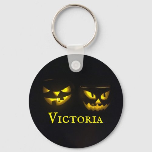 Personalised yellow on black creepy pumpkins round keychain