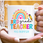 Personalized 3rd Grade Rainbow Teacher Coffee Mug<br><div class="desc">A Cute teacher gift for your favorite teacher. This fun design has 3rd grade teacher in colorful letters, a watercolor rainbow and the teacher's name. One of a kind teacher gift for end of the year or teacher appreciation gift. The name of the school can be added to the mug....</div>