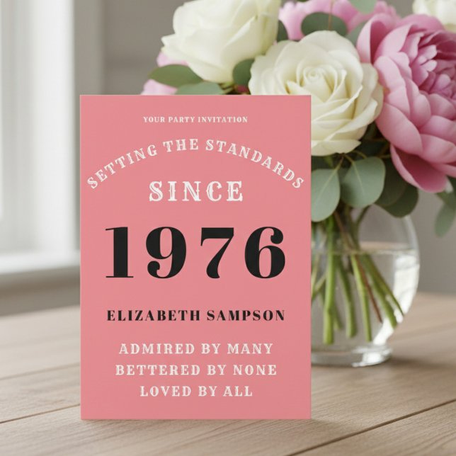 Personalized 50th Birthday 1976 Add Your Name Pink Invitation (1976 pink birthday invitation on a table with flowers.)