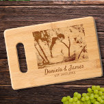 Personalized Anniversary Couple Photo Keepsake Engraved Cutting Board<br><div class="desc">Capture the essence of your love story with our personalized Engraved Cutting Board, featuring a cherished photo of you and your partner alongside your names in elegant calligraphy script. Immortalize the magic of your special day by including your wedding date, creating a heartfelt tribute to your journey together. This cutting...</div>