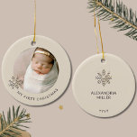 Personalized Baby Girl's First Christmas Ornament<br><div class="desc">Capture the magic of your baby girl's first Christmas with our "Personalized Baby Girl's First Christmas Ornament." The front of this exquisite ornament features a precious photo of your little one, framed by a graceful champagne gold snowflake on the left, with customizable text below to mark the occasion. The light...</div>