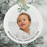 Personalized Baby's First Christmas Photo  Ceramic Ornament<br><div class="desc">This modern First Christmas Ornament is decorated with watercolor mistletoe.
Easily customizable with your photo,  name,  and year.
Use the Design Tool to change the text size,  style,  or color.
Because we create our artwork you won't find this exact image from other designers.
Original Watercolor © Michele Davies.</div>