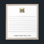 Personalized Beige Linen Gold Monogram Notepad<br><div class="desc">Stay organized in style with this personalized beige linen notepad featuring a sophisticated black and gold monogram design. The lined pages provide ample space for jotting down notes, to-do lists, and more, while the elegant design adds a touch of luxury to your everyday life. Perfect for personal use or as...</div>